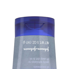 Clean & Clear applying scrub on face for daily acne-prone skin routine.