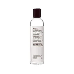 COCOCARE Coconut Moisturizing Oil label close-up indicating product benefits and usage.