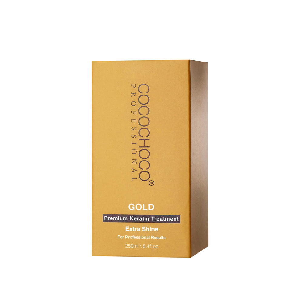 Cocochoco Gold keratin treatment being applied with a flat iron to seal moisture.