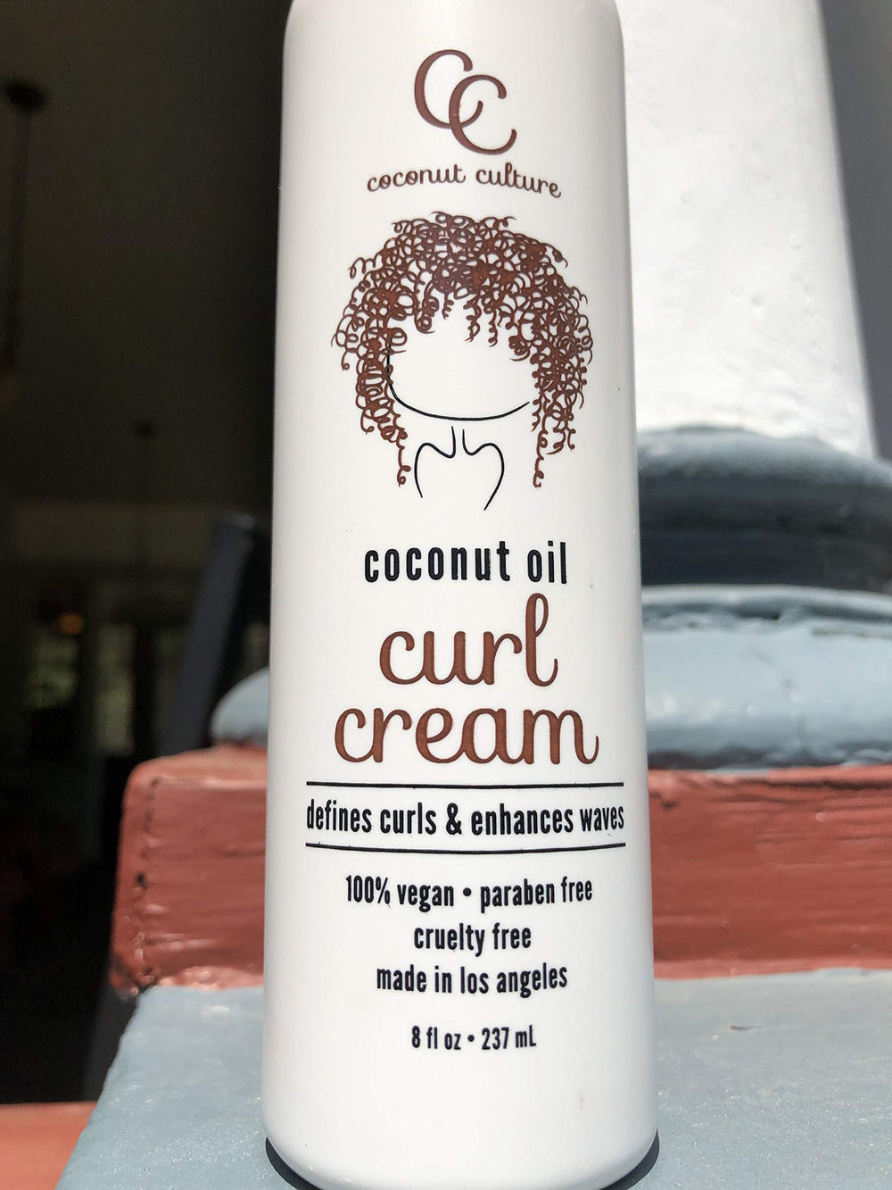Coconut Culture Curl Cream hands-on application on wet hair for frizz control.