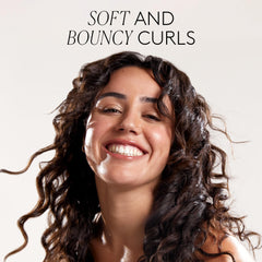 COCUNAT 3 Curl Booster pump demonstrates moisture-rich styling on damp curls.