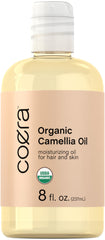 Coera Camellia Oil bottle highlighting organic formula for hair and skin.