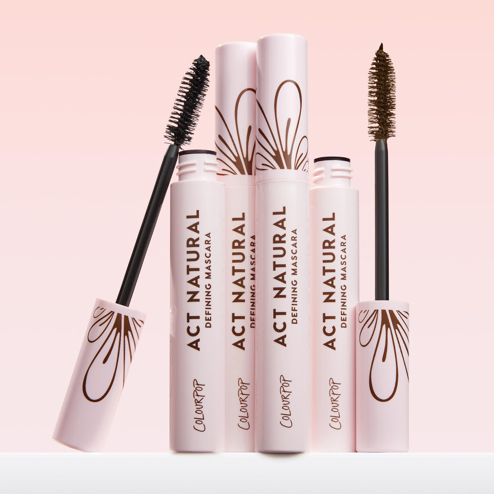 ColourPop Act Natural Defining Mascara tube beside neutral backdrop for everyday wear.