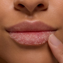 Applying ColourPop Fresh Kiss lip scrub on lips for gentle exfoliation.