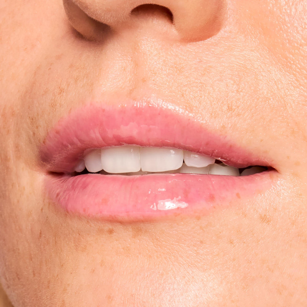 ColourPop lip balm application close-up showing a glossy finish for daily wear.