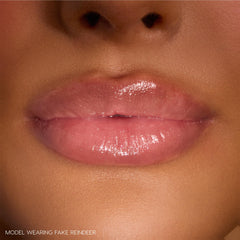 ColourPop Grinchmas Swirl gloss on lips shows non-sticky shine and soft, hydrated feel.