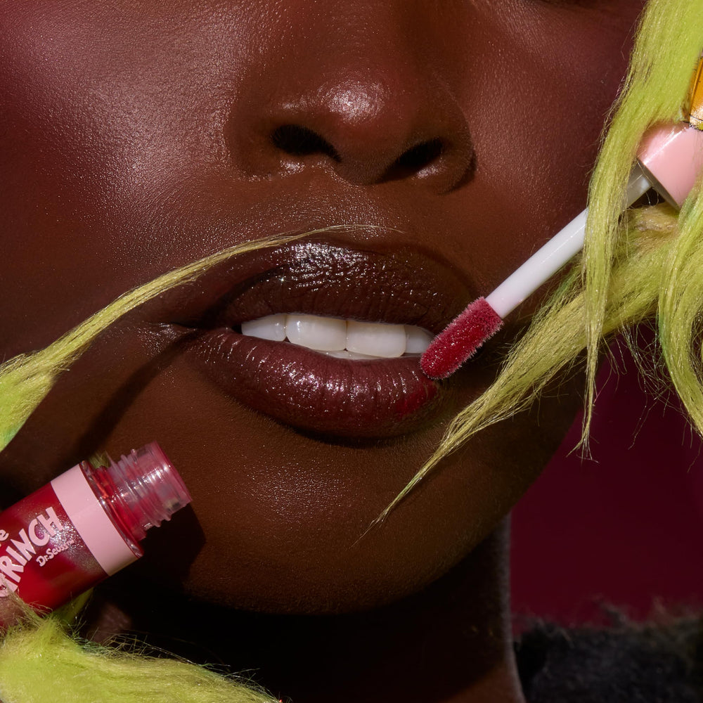 ColourPop Grinchmas Swirl lip gloss swatch reveals sheer color and pearly shimmer.