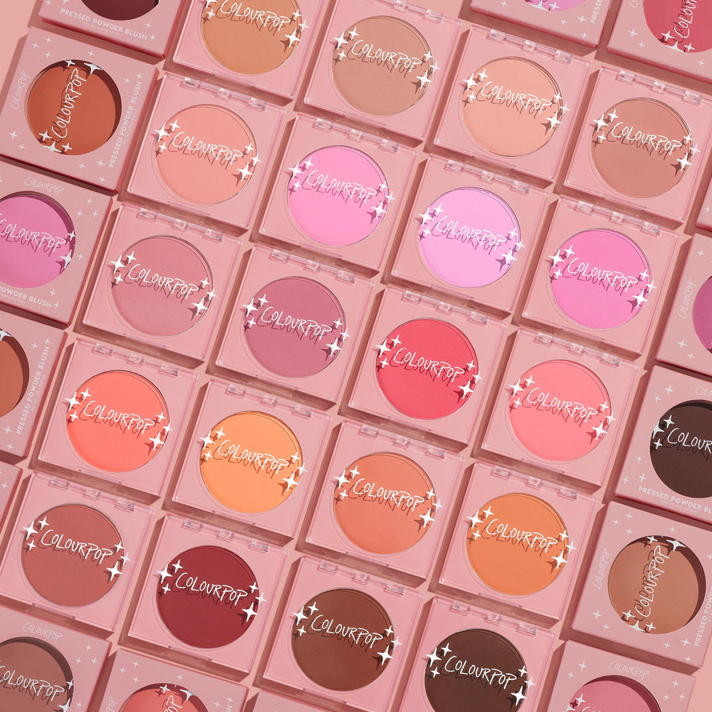 ColourPop Silky Powder Blush heart-shaped compact on vanity highlights cute, portable makeup.