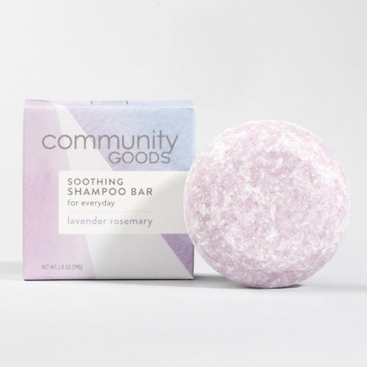 Community Goods Lavender Rosemary Shampoo Bar in hand, travel-friendly plastic-free care.