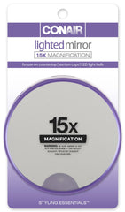 Conair 15x magnification lighted suction mirror attached to a smooth surface for precise makeup detail