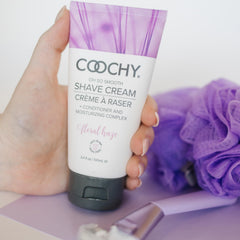 Coochy Floral Haze foam dispense close-up suggesting creamy, glide-ready texture.