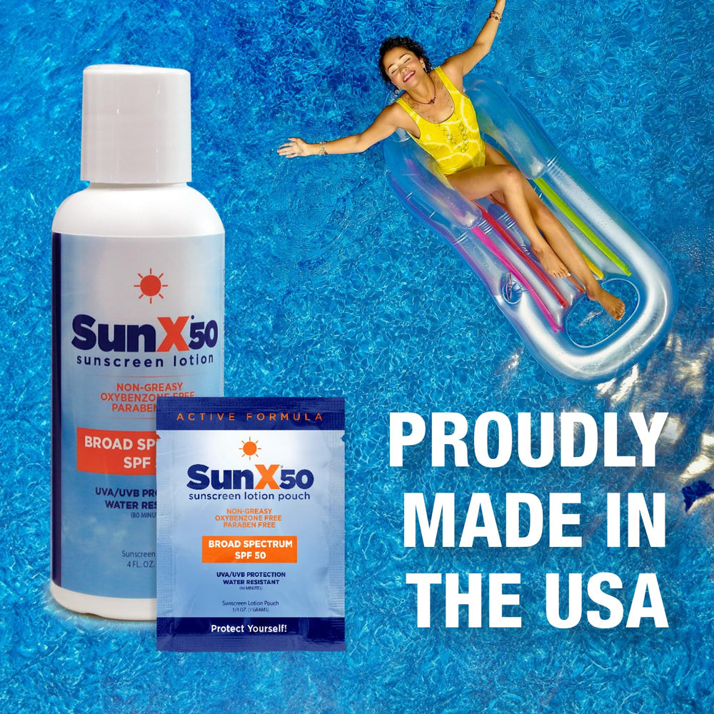 CoreTex Sun X 50 SPF packets on sandy beach with ocean backdrop.