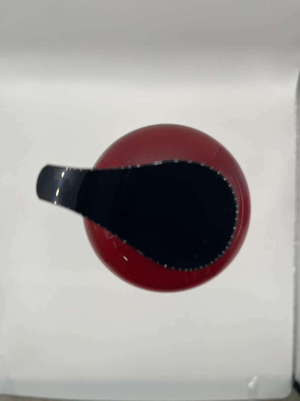 COSMOCOS REDFLO made in South Korea label on bottle.
