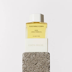 Costa Brazil Kaya Jungle Firming Body Oil travel-size bottle for on-the-go moisture.