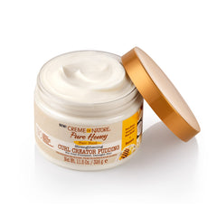 Creme of Nature Curl Pudding texture close-up suggests rich moisturizing application.
