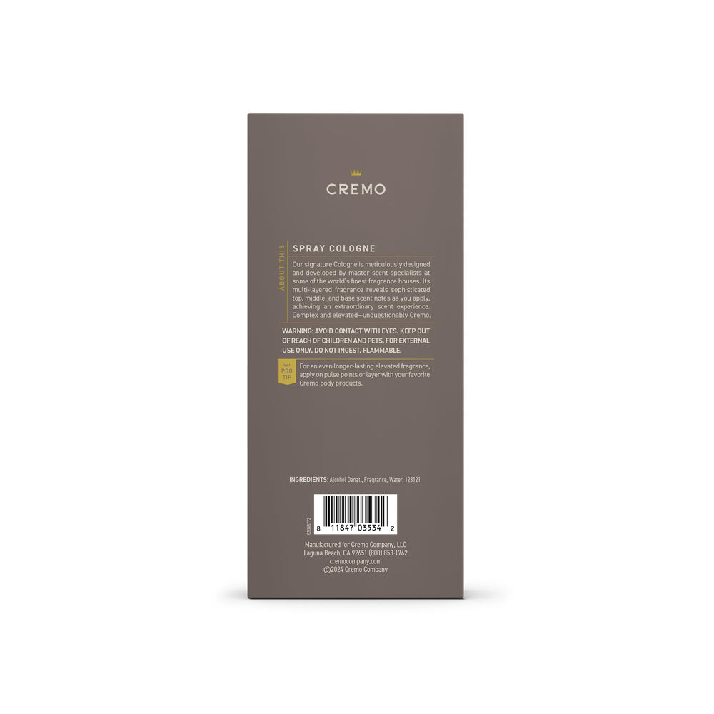 Cremo Vintage Suede bottle with amber backdrop, showcases rich suede notes.
