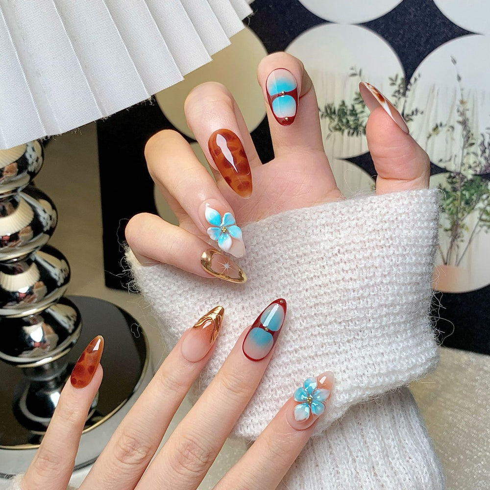 CTTHNBD almond brown ombre nails with decorative flower detail