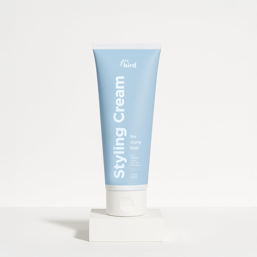 Curly Bird Curl Defining Styling Cream bottle for easy application