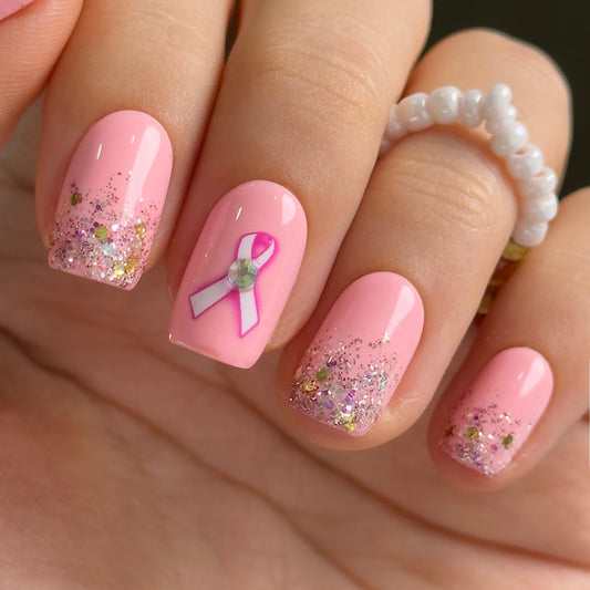 Curvlife press-on nails with pink ribbon glitter and glossy finish for instant glamour.