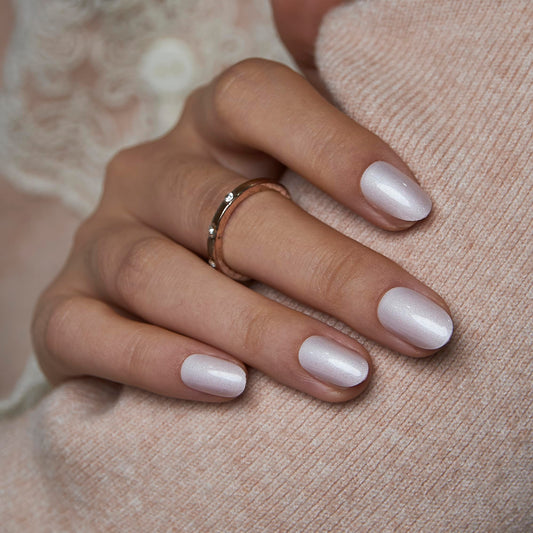 Curvlife short oval press-on nails in Moonlight Pearly Shimmer for a glossy salon-like look.