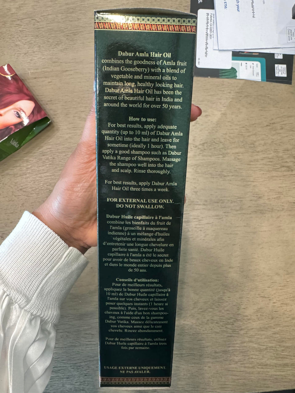 Dabur Amla Hair Oil ingredients highlight amla for scalp nourishment.