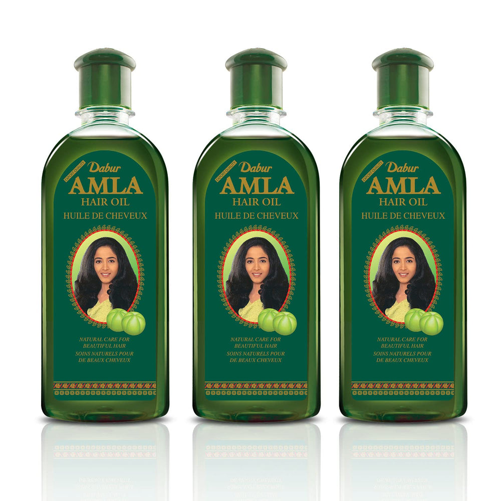 Dabur Amla Hair Oil pour action shown for easy application and hair shine.