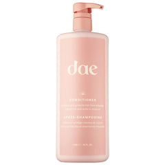 DAE Signature Conditioner bottle closeup highlighting moisture and frizz control