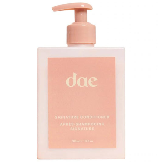 DAE Signature Conditioner bottle close-up showing moisture for softer hair.