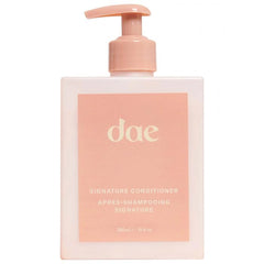 DAE Signature Conditioner bottle close-up showing moisture for softer hair.