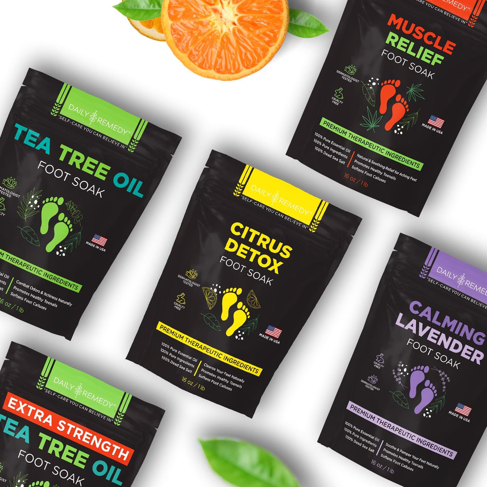 Daily Remedy Citrus Detox Foot Soak near towels signals a spa-like pedicure routine.
