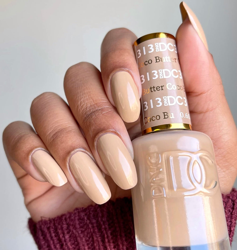 Daisy DND Coco Butter lacquer bottle matches the gel color for a cohesive look.