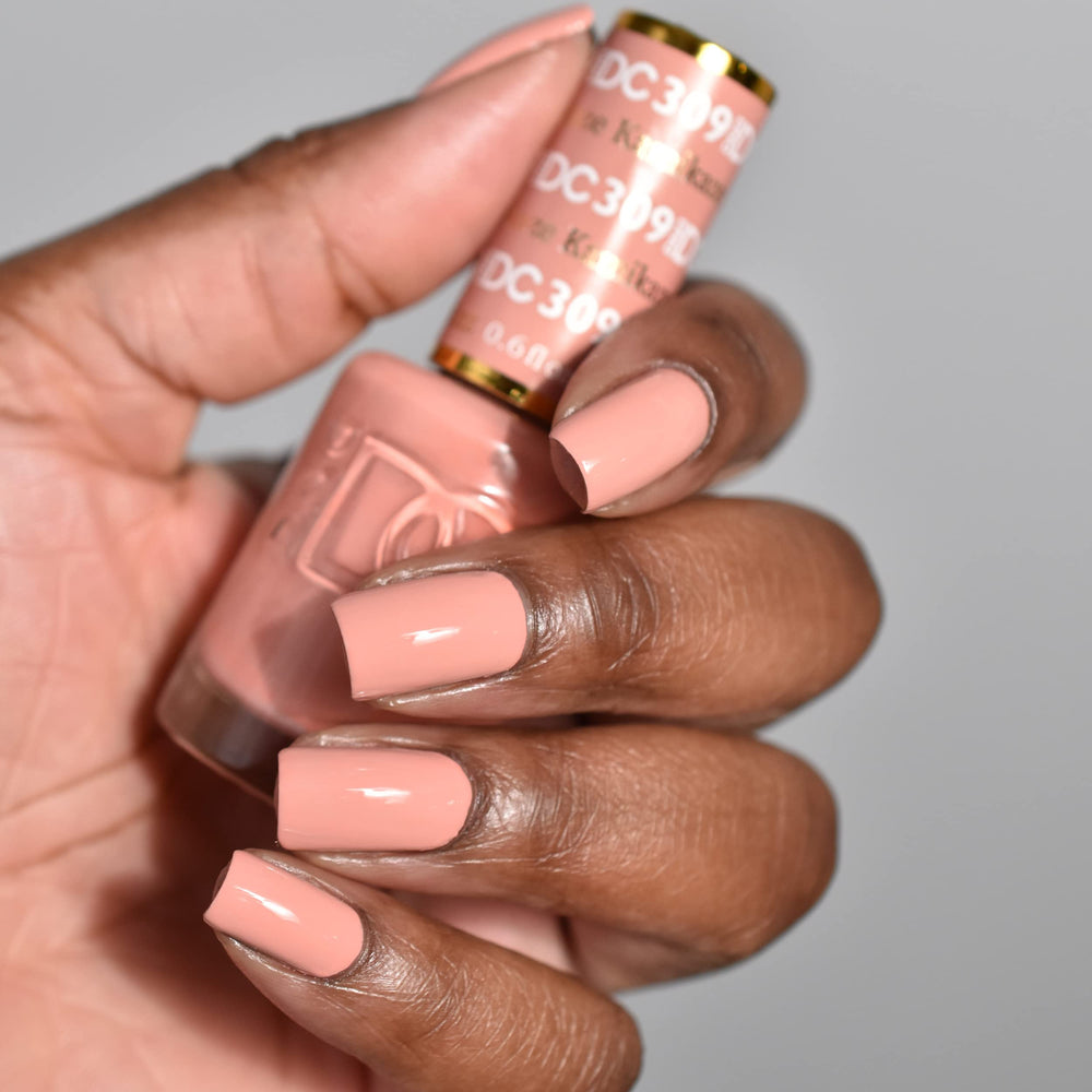 DAISY DND Kamikaze lacquer bottle paired with gel polish for a durable, chip-free finish