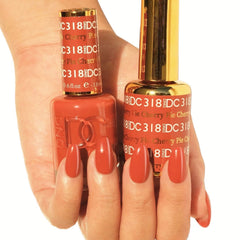 Daisy DND orange lacquer bottles paired with gel polish for quick-dry nails