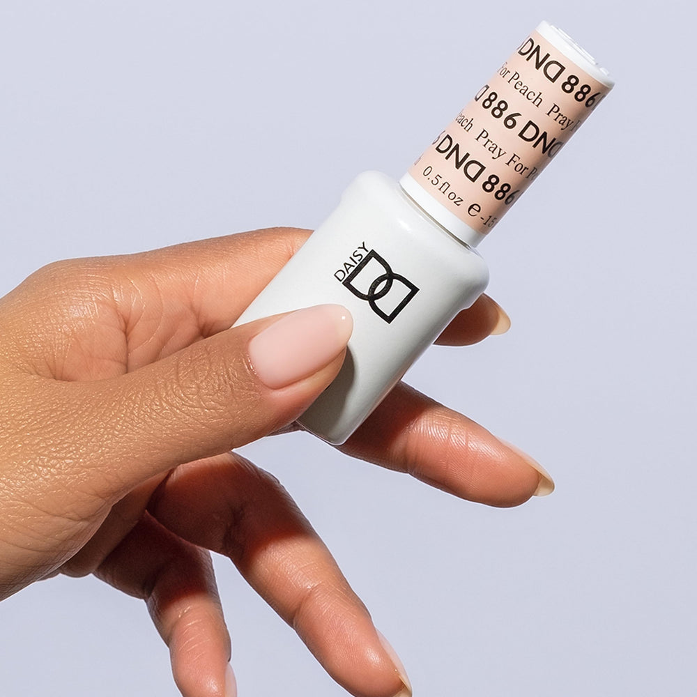 DAISY DND Pray For Peach nail lacquer bottle highlighting versatile finish and quick dry time.