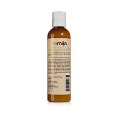 Damila Nourishing Conditioner pours from bottle, smoothing frizz and curls
