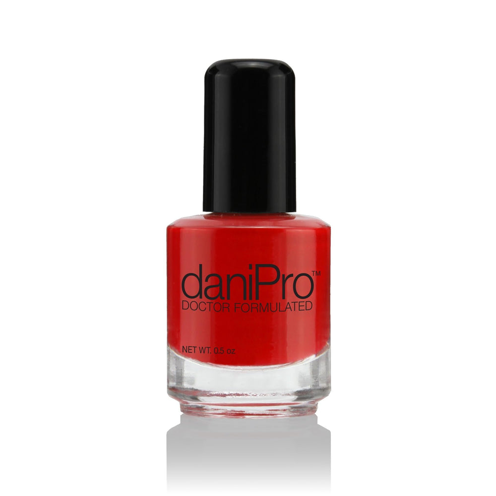 daniPro First Kiss bottle front with bold red nail polish shade