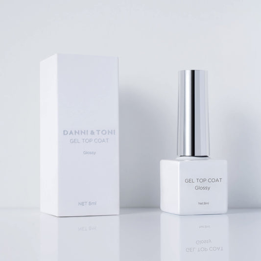 DANNI & TONI glossy top coat bottle delivers long-lasting high shine for nails.