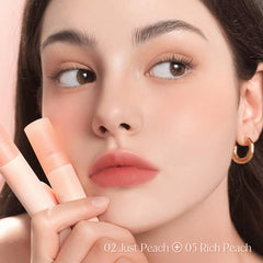 Dasique Water Blur Tint 05 Rich Peach silky finish appears after application.