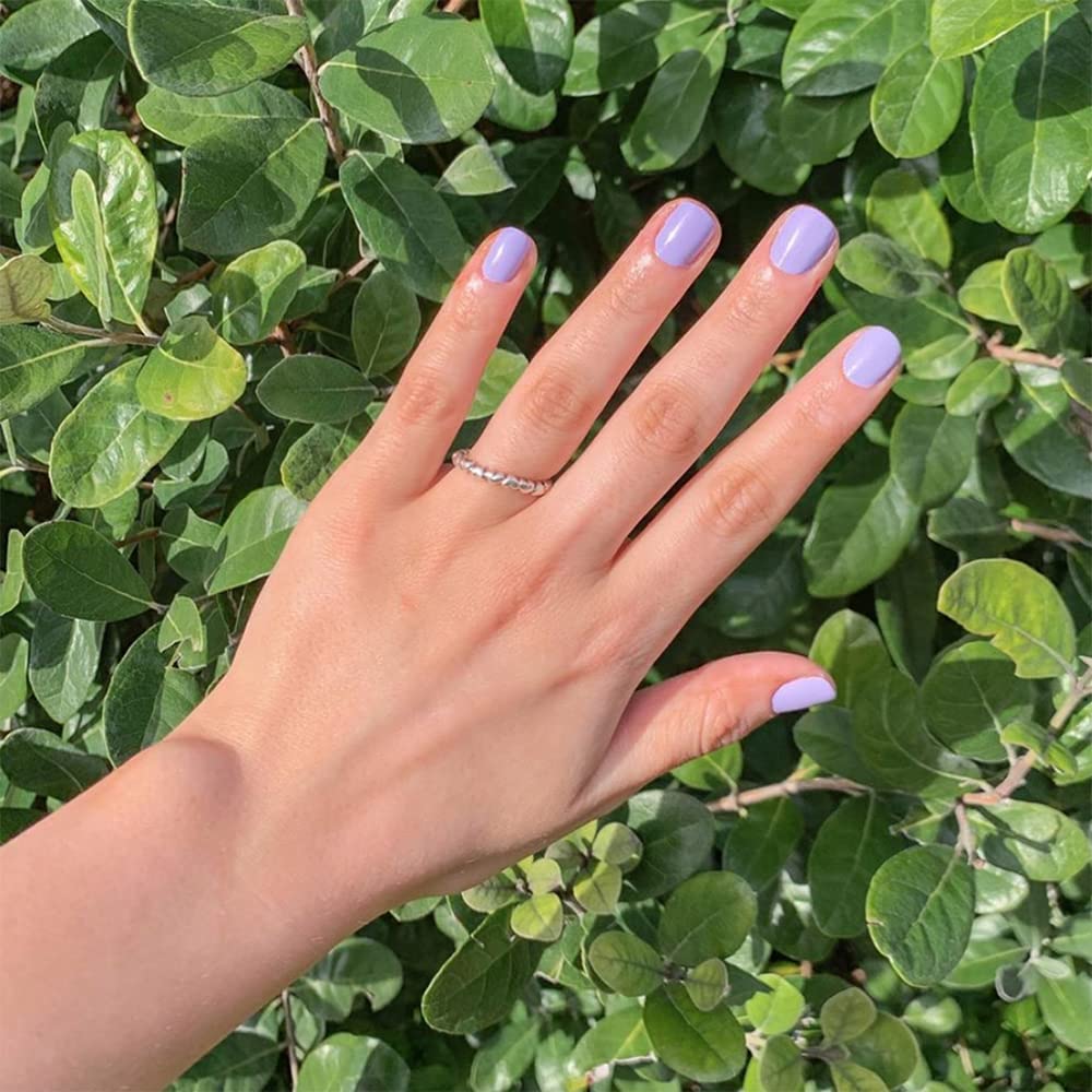 Dazzle Dry Faith lacquer brush applying even, smooth color on nails.