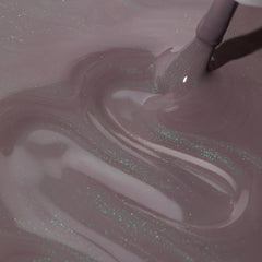 Dazzle Dry Lets Glow semi-sheer finish reveals purple taupe with green shimmer.