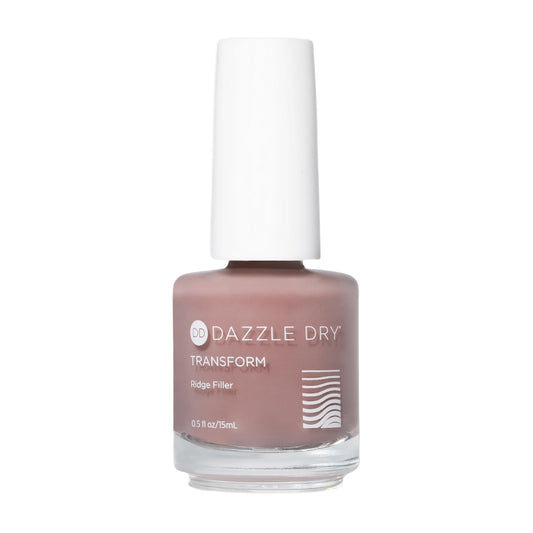 Dazzle Dry Nude Transform ridge filler bottle close-up; neutral beige for natural look.