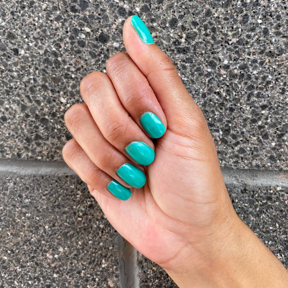 Dazzle Dry Palm Springs on‑nail shot demonstrates smooth application and even color.
