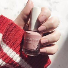 Dazzle Dry Strawberry Macaron swatches reveal a pale strawberry tone on skin.