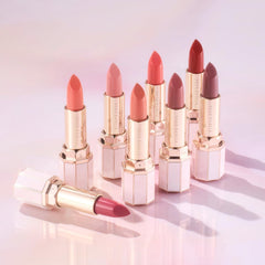 Dear Dahlia Lip Paradise provides a sheer red-orange tint for natural lip color enhancement.