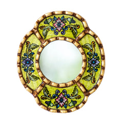 DecorContreras small oval mirror with bronze-leaf frame adds timeless sophistication.