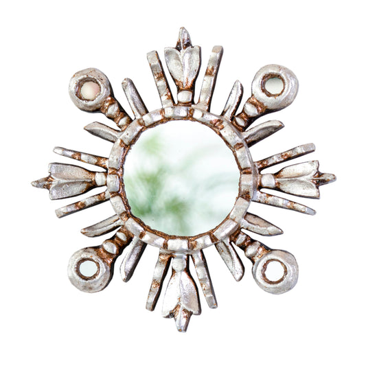 DecorContreras sunburst mirror 6in on a bright wall for chic wall decor.