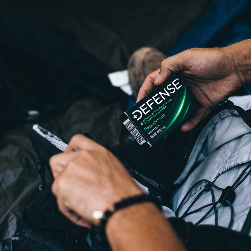 Defense Soap lather on hand during shower for thorough cleansing