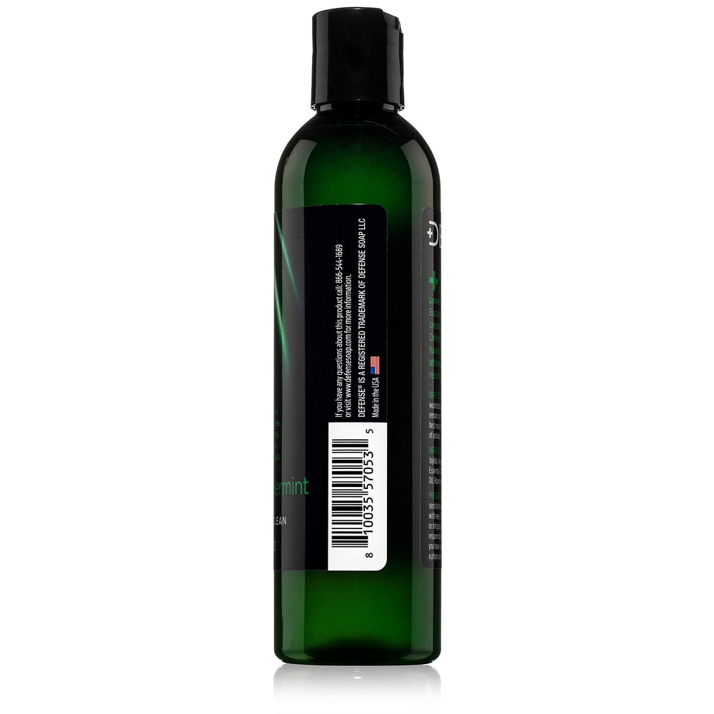 Defense Soap Peppermint Tea Tree Body Wash in bathroom shelf setup