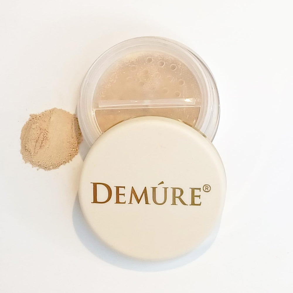 DEMÚRE Demure Mineral Concealer swatch on hand with yellow-toned camouflage.