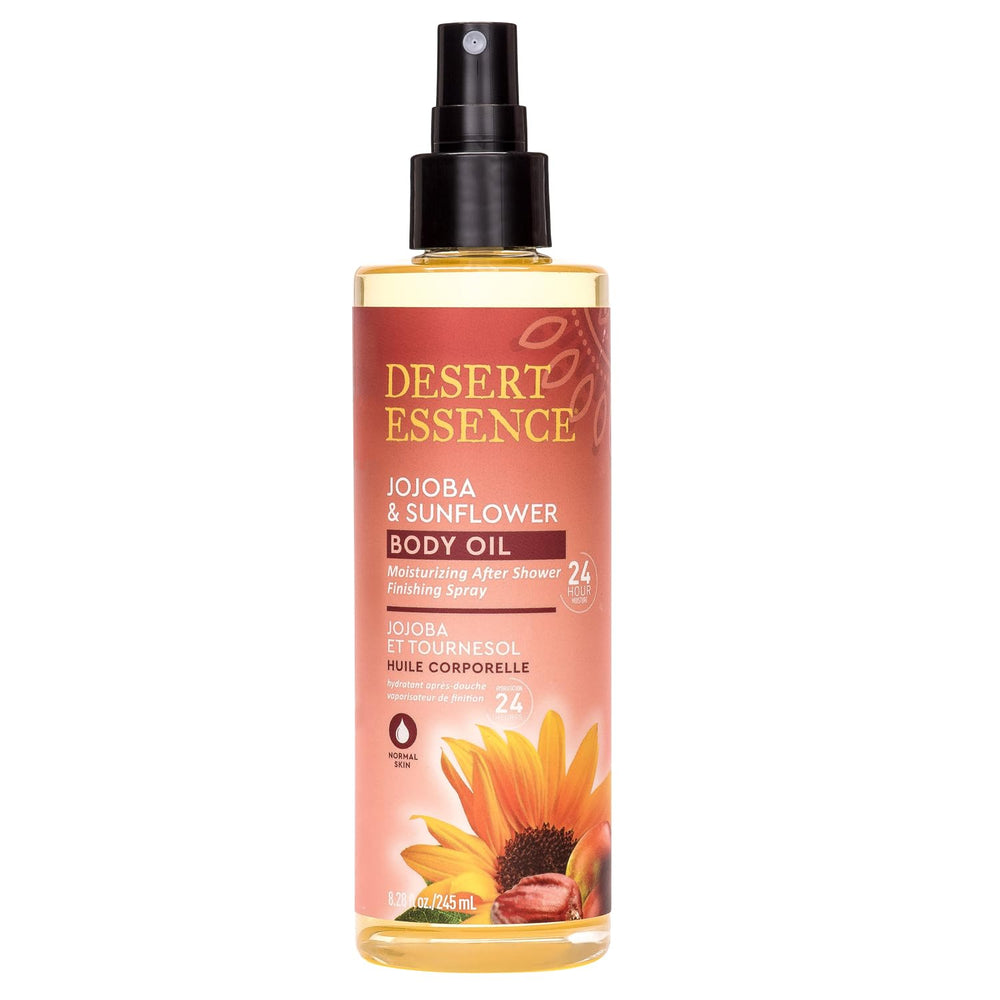 Desert Essence body oil spray applied to skin for quick absorption